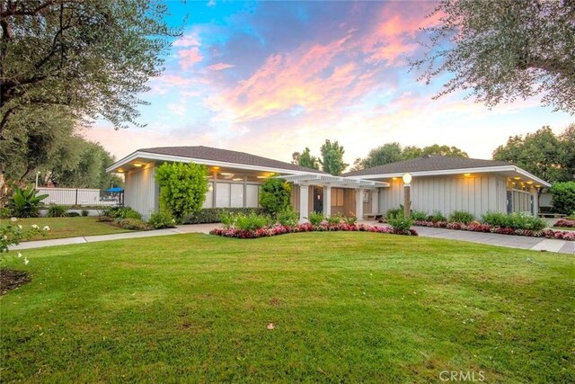 6898 Breton Way, Cypress, CA 90630 - single story home with a pergola, a front yard, and board and batten siding