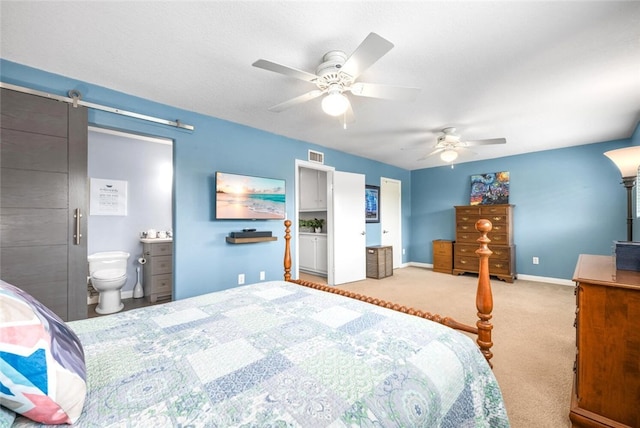 6898 Breton Way, Cypress, CA 90630 - carpeted bedroom featuring a ceiling fan, ensuite bath, and a barn door