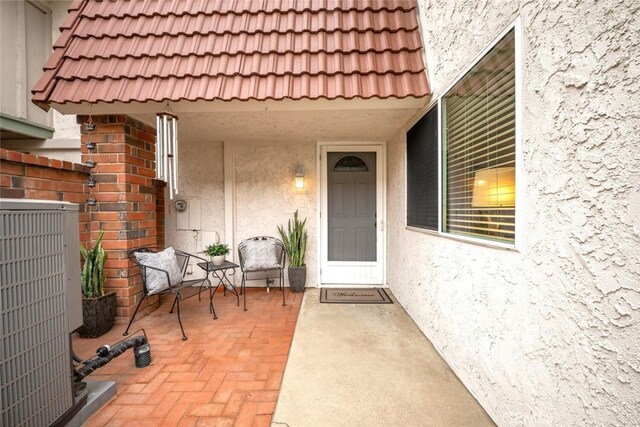 6898 Breton Way, Cypress, CA 90630 - entrance to property with stucco siding, central air condition unit, and a tile roof