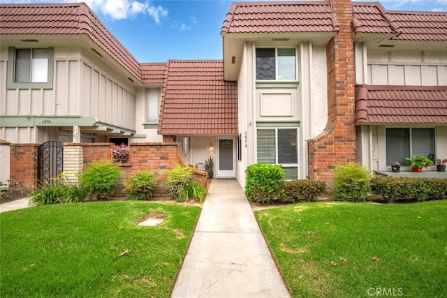 6898 Breton Way, Cypress, CA 90630 - view of front of house featuring a tile roof, stucco siding, and a front yard