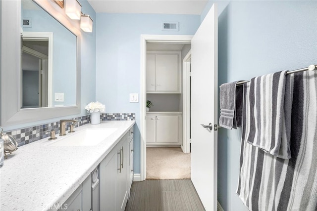 6898 Breton Way, Cypress, CA 90630 - bathroom featuring vanity and decorative backsplash