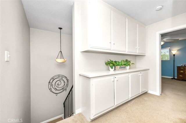 6898 Breton Way, Cypress, CA 90630 - hall with light colored carpet, baseboards, and a textured ceiling