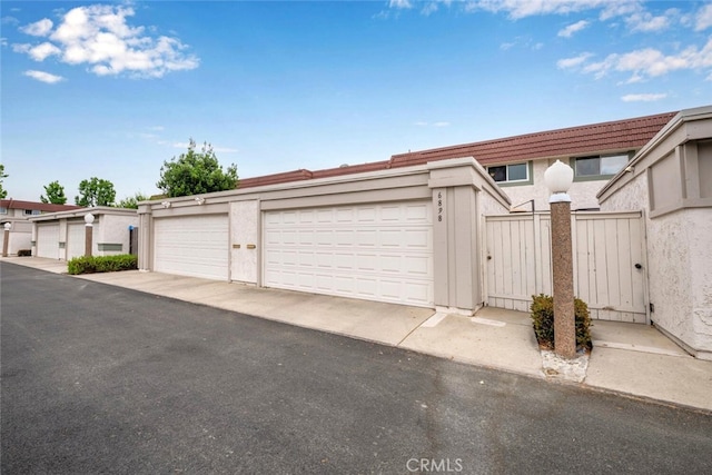 6898 Breton Way, Cypress, CA 90630 - garage featuring a gate
