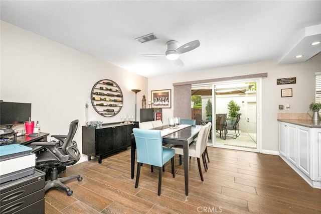 6898 Breton Way, Cypress, CA 90630 - dining room featuring dark wood-style flooring, ceiling fan, a desk, and baseboards