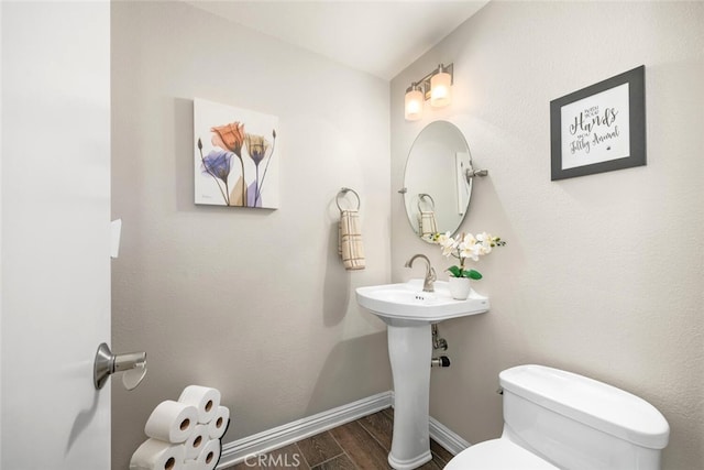 6898 Breton Way, Cypress, CA 90630 - half bath featuring toilet and wood finished floors