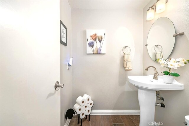 6898 Breton Way, Cypress, CA 90630 - bathroom featuring baseboards and wood finished floors