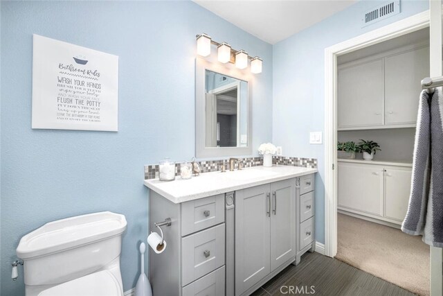 6898 Breton Way, Cypress, CA 90630 - bathroom featuring vanity, toilet, and wood finished floors