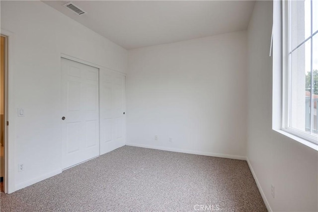 30 Oakhurst Rd, Irvine, CA 92620 - unfurnished bedroom featuring carpet floors, baseboards, and a closet