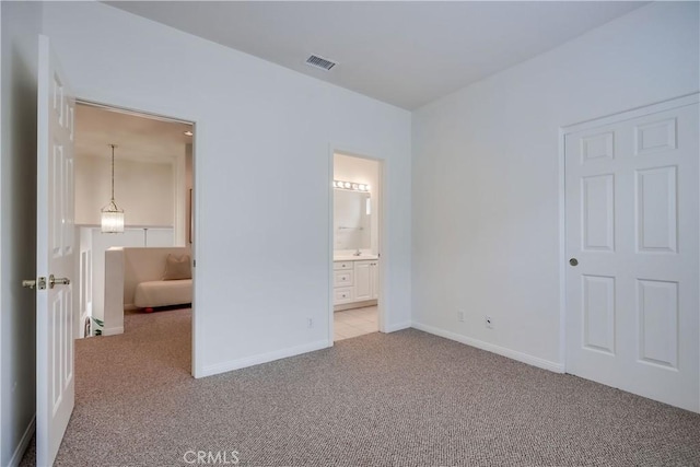 30 Oakhurst Rd, Irvine, CA 92620 - unfurnished bedroom featuring carpet flooring, baseboards, connected bathroom, and a sink