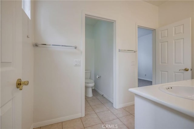 30 Oakhurst Rd, Irvine, CA 92620 - bathroom featuring toilet, tile patterned floors, vanity, and baseboards