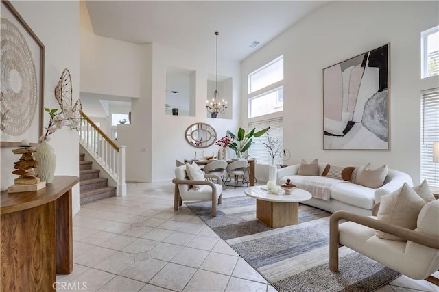 30 Oakhurst Rd, Irvine, CA 92620 - living room with a chandelier, stairs, a towering ceiling, and light tile patterned floors