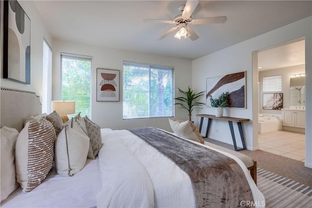 30 Oakhurst Rd, Irvine, CA 92620 - carpeted bedroom featuring ensuite bathroom, a ceiling fan, tile patterned flooring, and baseboards