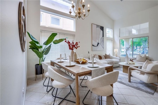 30 Oakhurst Rd, Irvine, CA 92620 - dining space with high vaulted ceiling, light tile patterned floors, a chandelier, and baseboards