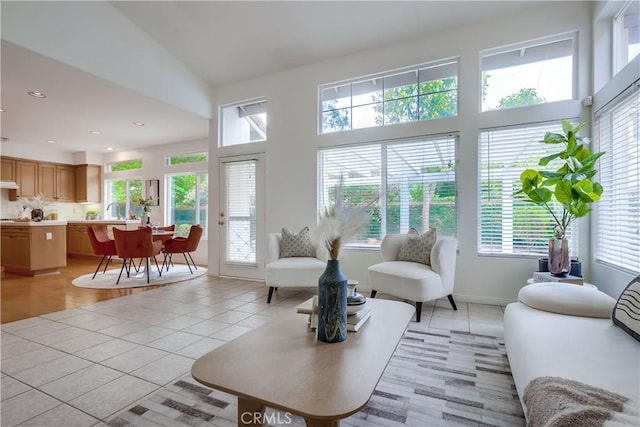 30 Oakhurst Rd, Irvine, CA 92620 - living area with light tile patterned floors, a towering ceiling, and recessed lighting