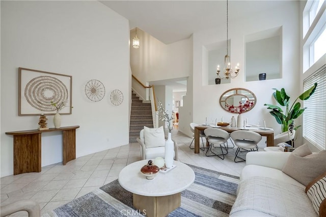 30 Oakhurst Rd, Irvine, CA 92620 - tiled living room featuring stairs, a chandelier, and a towering ceiling