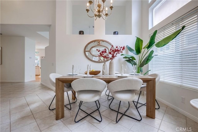 30 Oakhurst Rd, Irvine, CA 92620 - tiled dining space featuring a chandelier, baseboards, and a towering ceiling