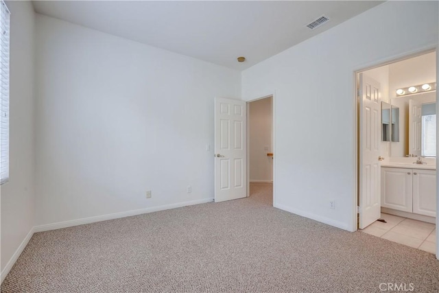 30 Oakhurst Rd, Irvine, CA 92620 - unfurnished bedroom featuring light carpet, baseboards, and ensuite bathroom