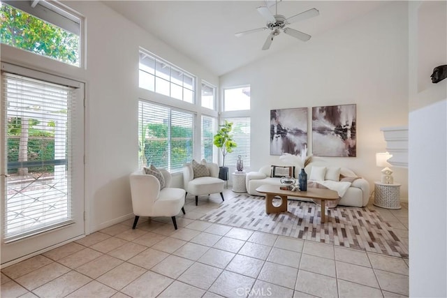 30 Oakhurst Rd, Irvine, CA 92620 - living area with high vaulted ceiling, light tile patterned flooring, ceiling fan, and baseboards