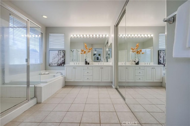 30 Oakhurst Rd, Irvine, CA 92620 - bathroom with double vanity, a garden tub, a stall shower, and tile patterned floors