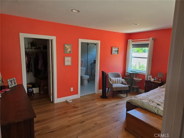 18334 Glenburn Ave, Torrance, CA 90504 - bedroom with light wood-type flooring, a spacious closet, recessed lighting, connected bathroom, and a closet