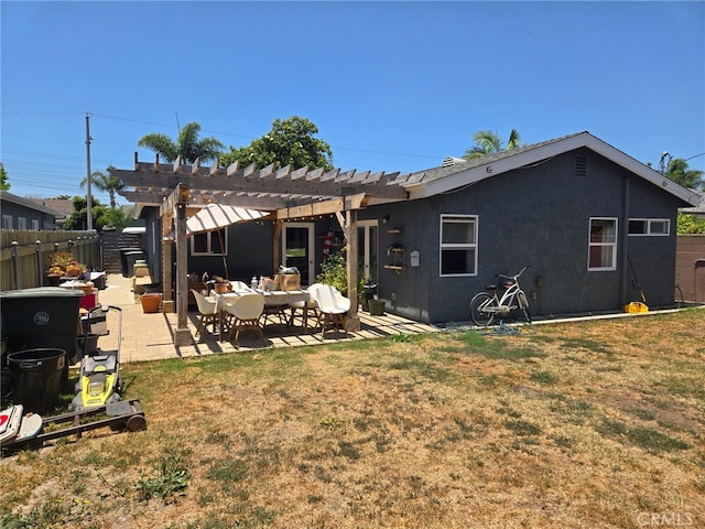 18334 Glenburn Ave, Torrance, CA 90504 - rear view of property featuring a pergola, a patio area, an outdoor living space, and stucco siding