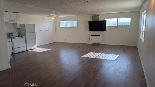 6445 Pony Rd, Johnson Valley, CA 92285 - unfurnished living room featuring heating unit, ceiling fan, dark wood-type flooring, and baseboards