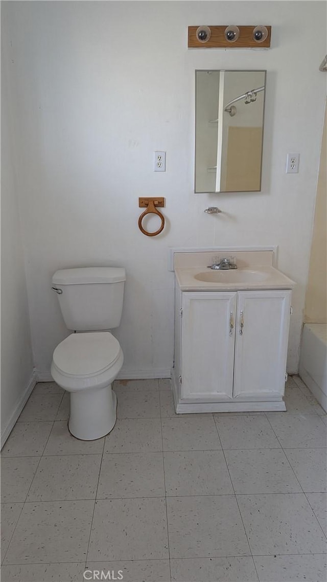 6445 Pony Rd, Johnson Valley, CA 92285 - bathroom with baseboards, vanity, toilet, tile patterned flooring, and a bathtub