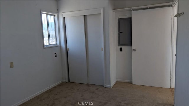6445 Pony Rd, Johnson Valley, CA 92285 - unfurnished bedroom with electric panel, carpet floors, a closet, and baseboards