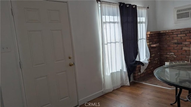 6445 Pony Rd, Johnson Valley, CA 92285 - foyer entrance featuring light wood-style flooring, a wall mounted AC, and baseboards