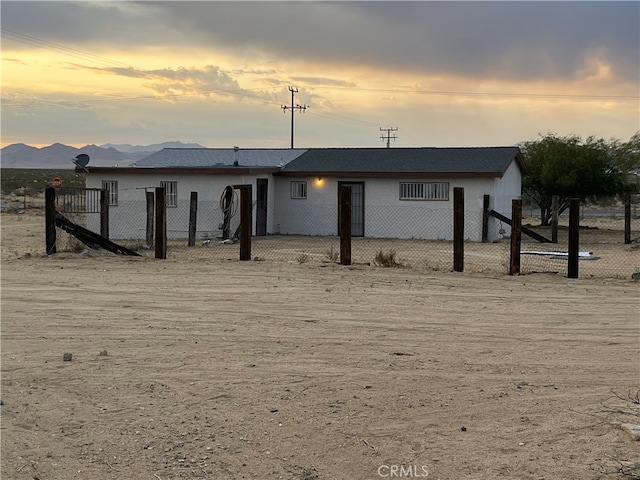 6445 Pony Rd, Johnson Valley, CA 92285 - back of property at dusk with stucco siding