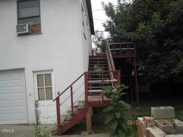 542 1st St, Fillmore, CA 93015 - rear view of house featuring stairway, stucco siding, a wooden deck, and cooling unit