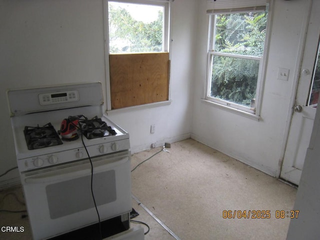 542 1st St, Fillmore, CA 93015 - kitchen with white gas stove and baseboards