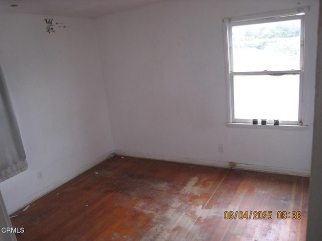 542 1st St, Fillmore, CA 93015 - spare room with wood-type flooring, healthy amount of natural light, and baseboards