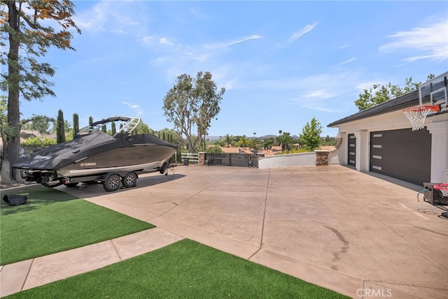 30195 Corte Coelho, Temecula, CA 92591 - view of patio featuring concrete driveway and a garage