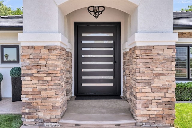 30195 Corte Coelho, Temecula, CA 92591 - view of exterior entry featuring stucco siding, a tile roof, and stone siding