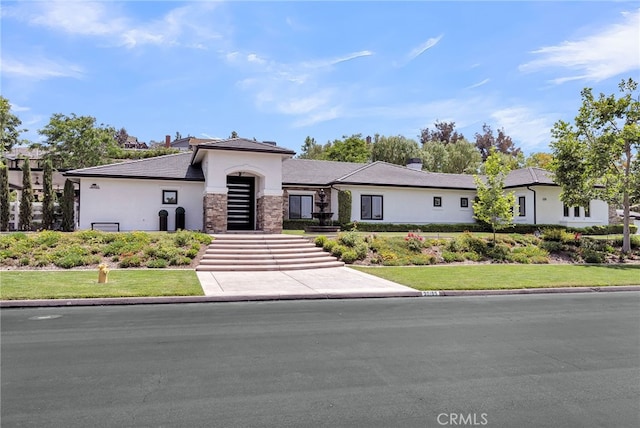 30195 Corte Coelho, Temecula, CA 92591 - view of front of property with stucco siding, stone siding, and a front lawn