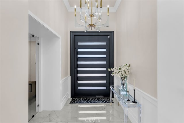 30195 Corte Coelho, Temecula, CA 92591 - entrance foyer with marble finish floors, a chandelier, ornamental molding, a wainscoted wall, and a high ceiling