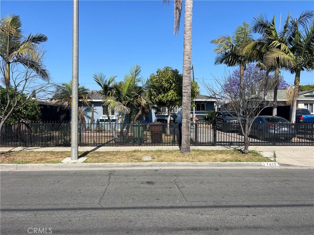 1412 S Northwood Ave, Compton, CA 90220 - obstructed view of property with a fenced front yard and concrete driveway