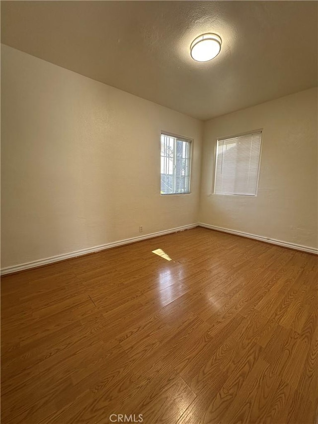 942 E 6th St, Pomona, CA 91766 - unfurnished room featuring wood finished floors and baseboards