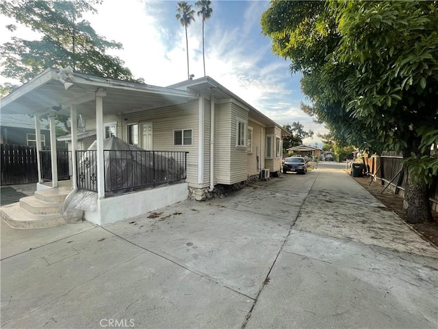 942 E 6th St, Pomona, CA 91766 - view of home's exterior featuring concrete driveway