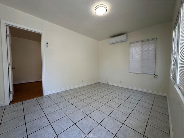 942 E 6th St, Pomona, CA 91766 - empty room featuring a wall mounted AC and light tile patterned flooring