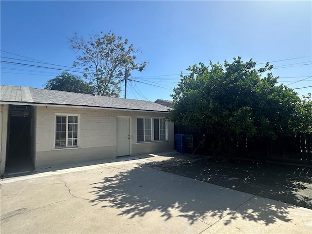 942 E 6th St, Pomona, CA 91766 - view of front facade with a patio area and a shingled roof