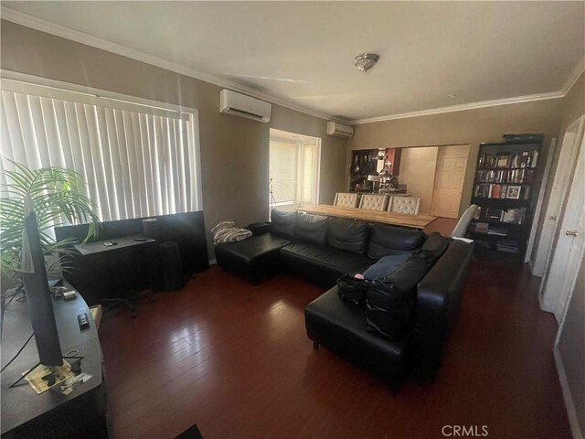 942 E 6th St, Pomona, CA 91766 - living room featuring wood finished floors, an AC wall unit, and crown molding