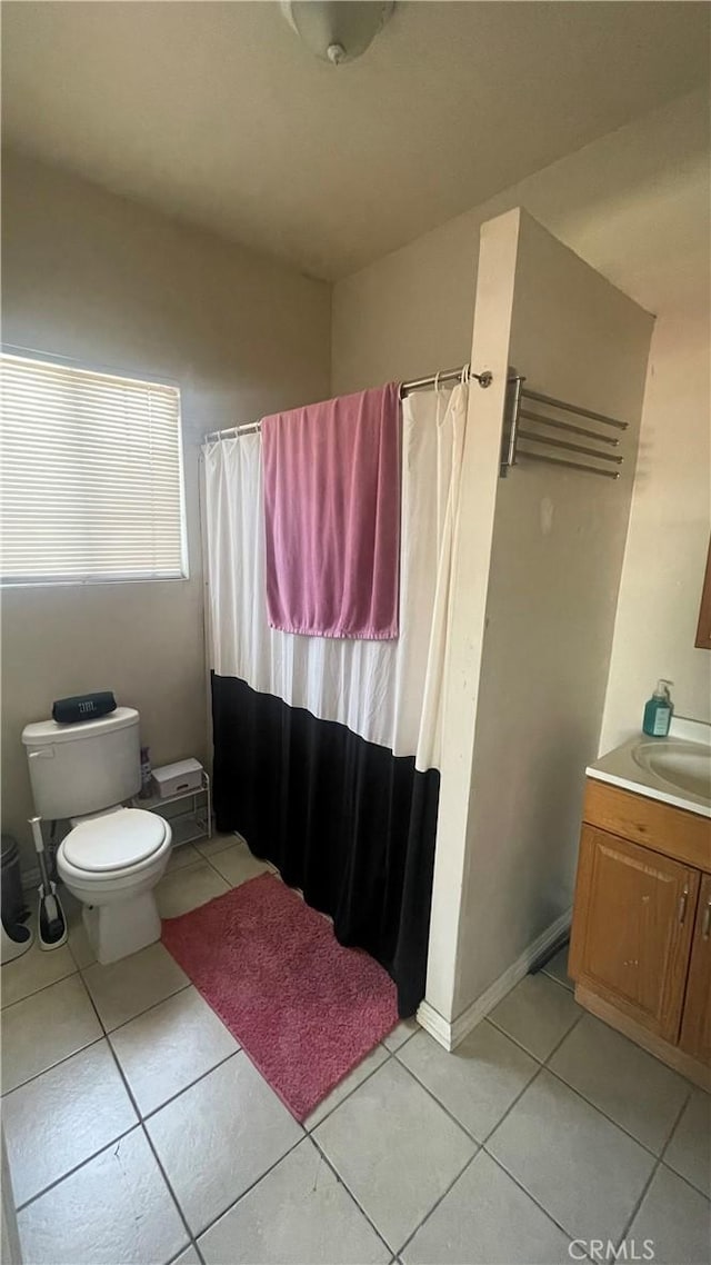 942 E 6th St, Pomona, CA 91766 - bathroom with vanity, tile patterned floors, and curtained shower