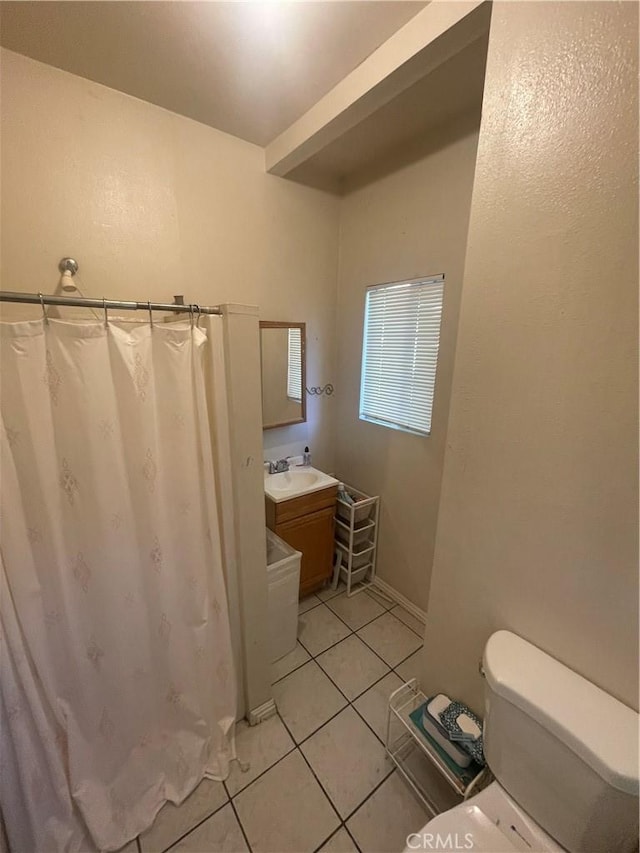 942 E 6th St, Pomona, CA 91766 - bathroom featuring tile patterned flooring, vanity, and a shower with curtain