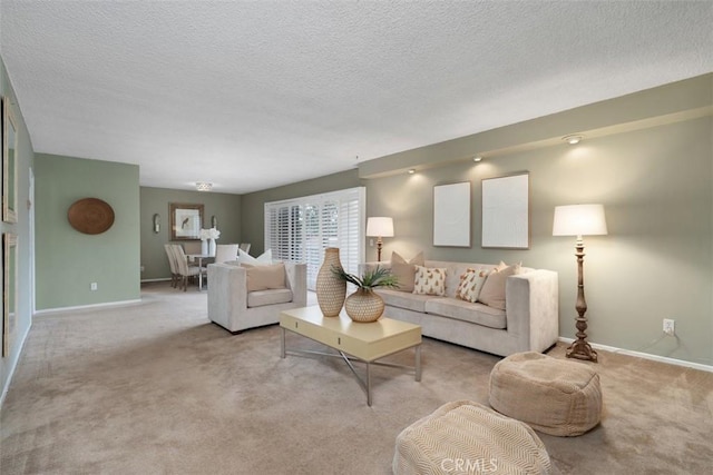 972 E California Blvd Unit 309, Pasadena, CA 91106 - living room featuring light carpet and a textured ceiling