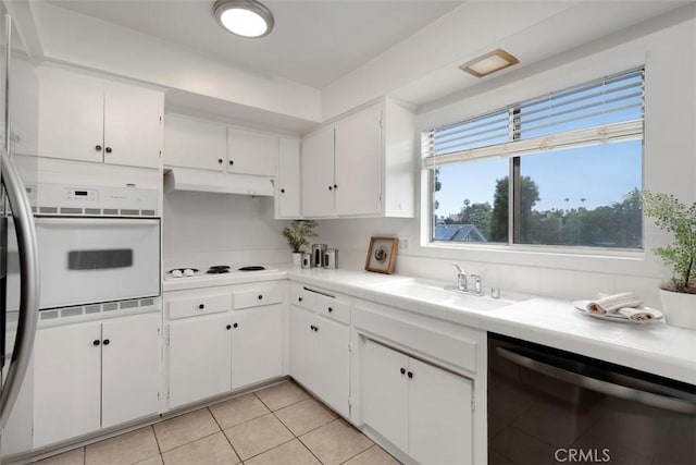 972 E California Blvd Unit 309, Pasadena, CA 91106 - kitchen with oven, dishwasher, white cabinetry, tile counters, and light tile patterned floors