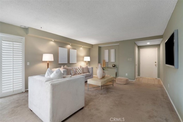972 E California Blvd Unit 309, Pasadena, CA 91106 - living area featuring a textured ceiling and light carpet