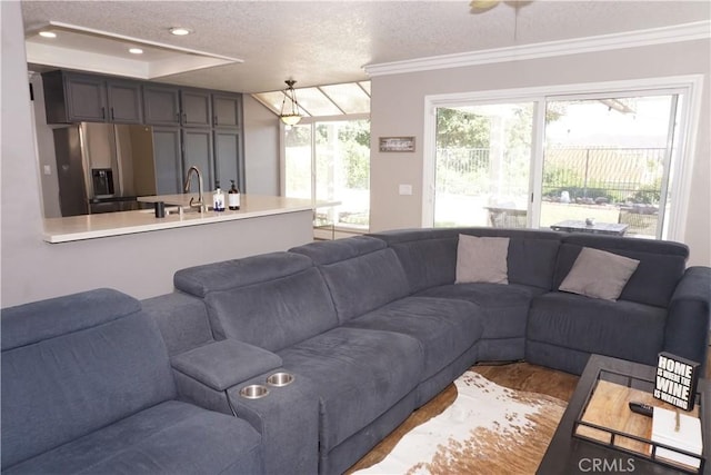 2622 Presidio Ln, Corona, CA 92879 - living area with ornamental molding, a textured ceiling, recessed lighting, wood finished floors, and a raised ceiling