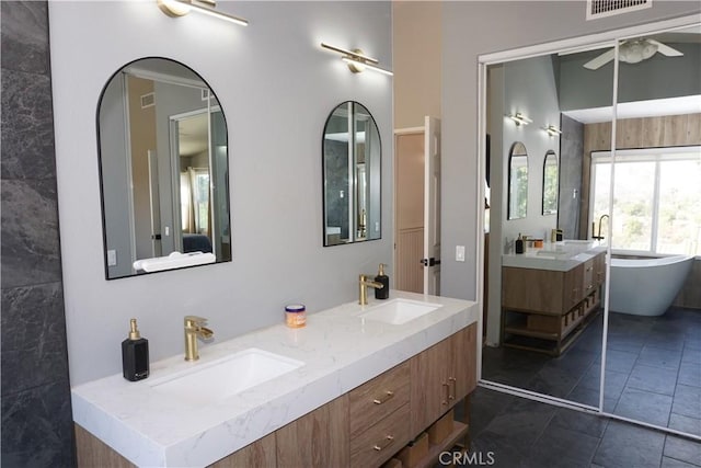 2622 Presidio Ln, Corona, CA 92879 - bathroom with double vanity, ceiling fan, and a freestanding bath